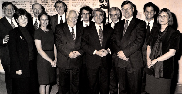 Black and white photograph of the attendees at the Jisc-JSTOR agreement signing at the United States Consulate in London, April 1998