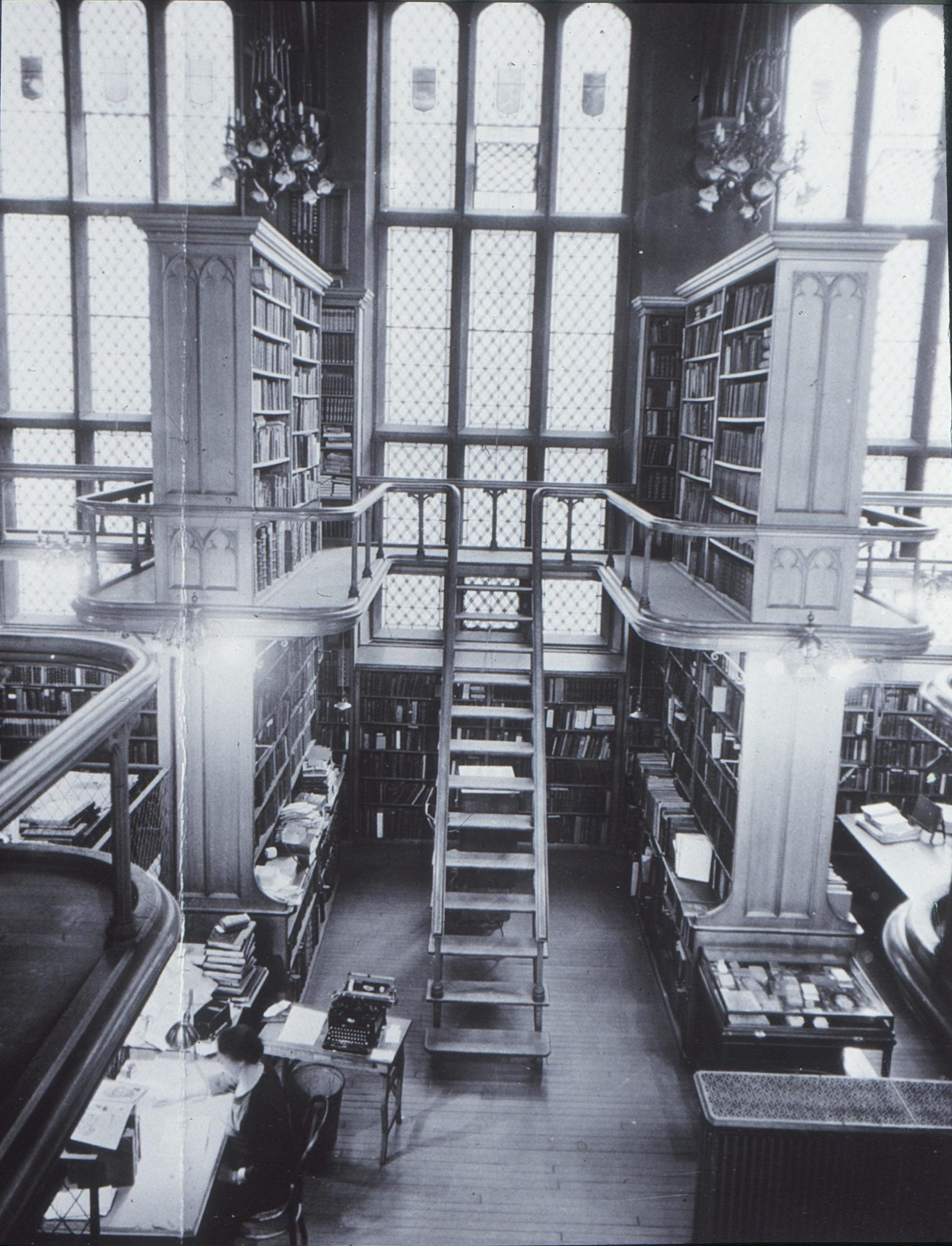 Photograph of the interior view of Watkinson Library Reading Room and book stacks