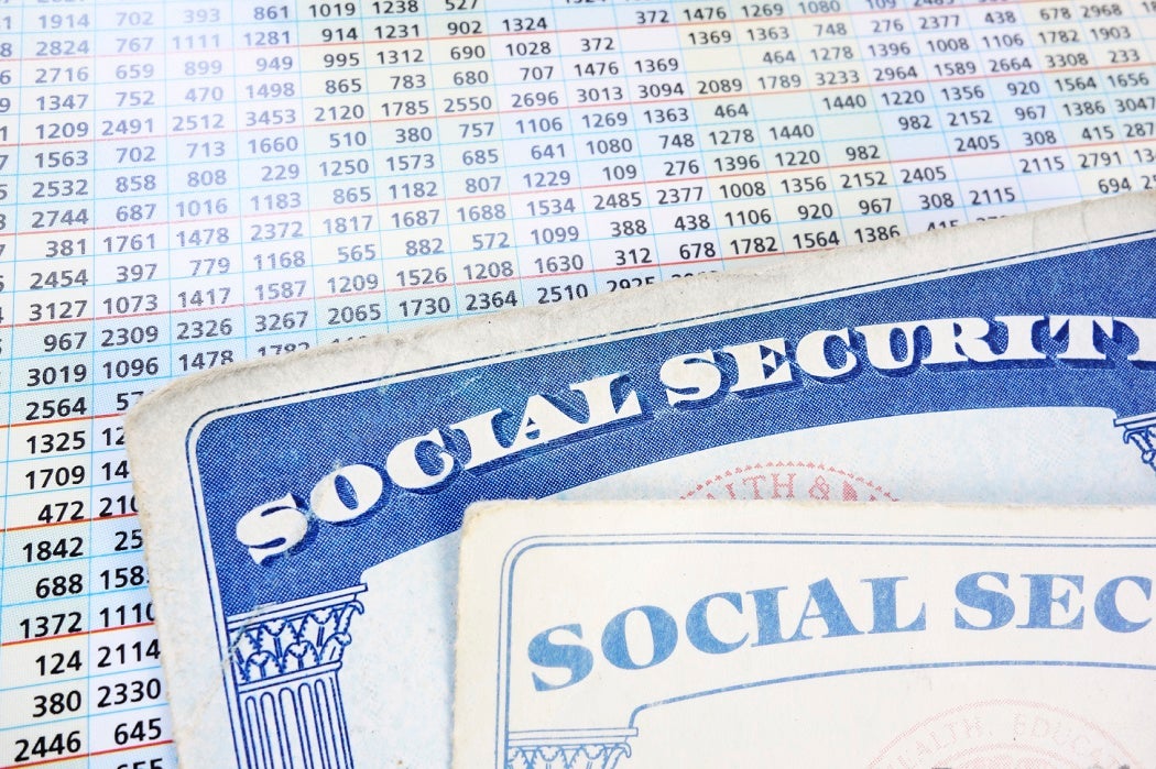 Social Security cards and a sheet of budget numbers