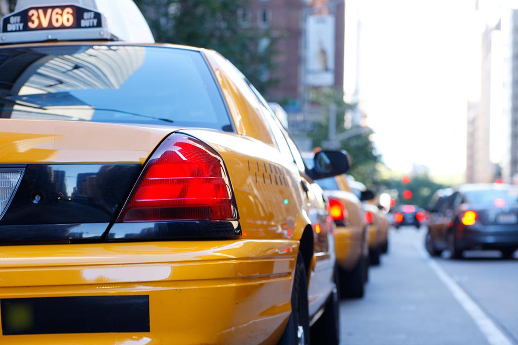 The back of a taxi in a busy street