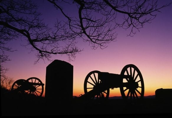 Relics from prior American War sit in the sunset