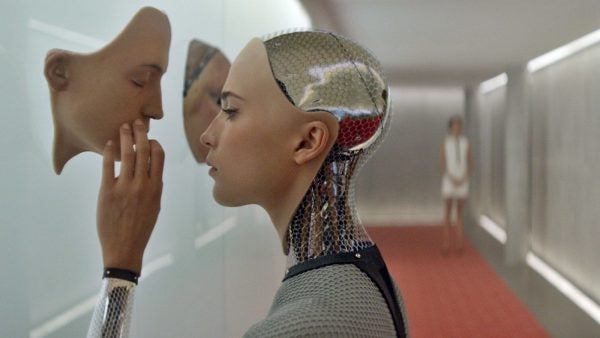 Still from the film "Ex-Machina" depicting Ava examining potential faces