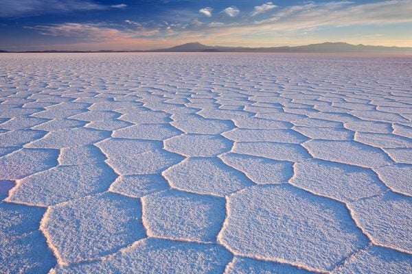 Salt flat Salar de Uyuni in Bolivia at sunrise