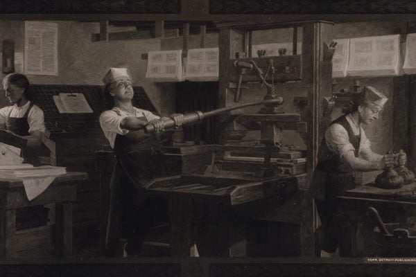 Benjamin Franklin at work on a printing press.