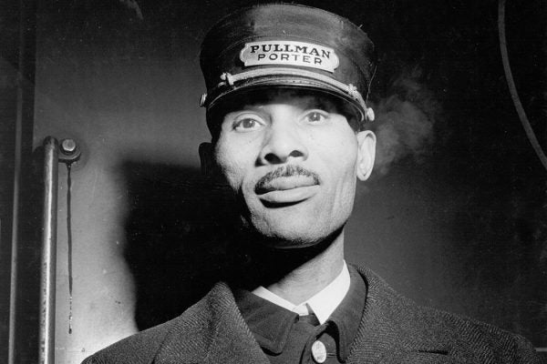 A sleeping car porter employed by the Pullman Company at Union Station in Chicago, Illinois.