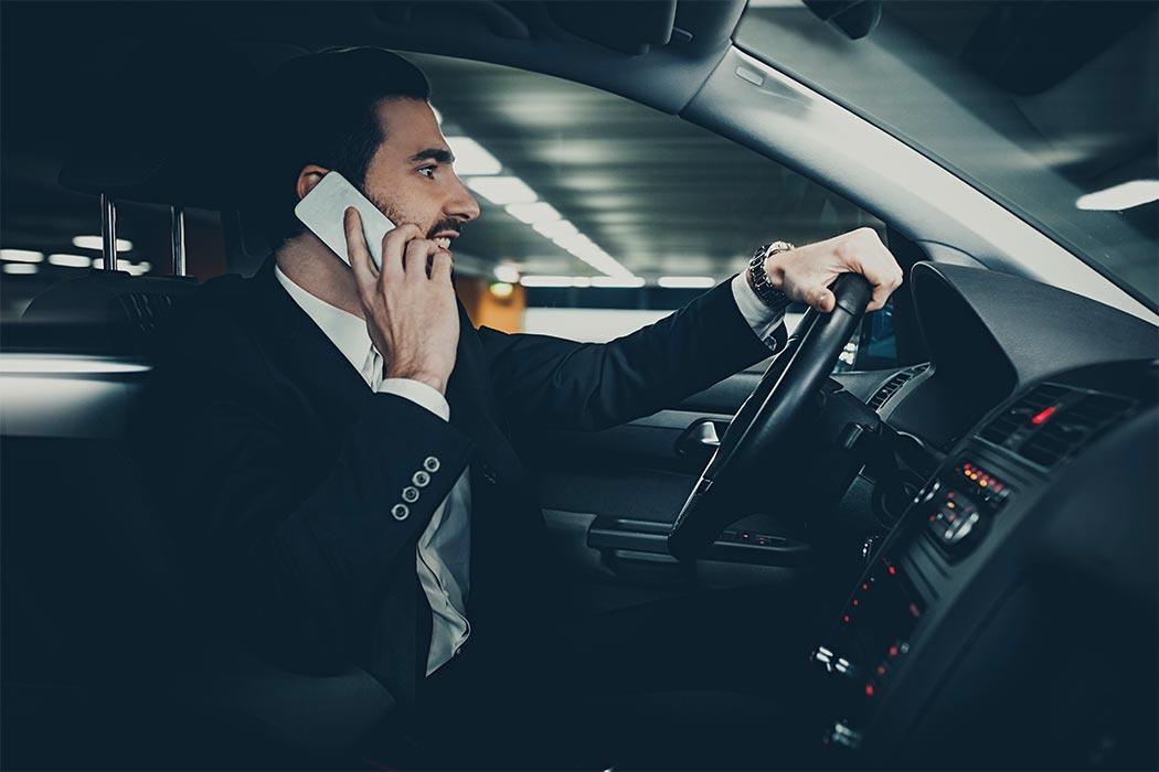 Businessman commuting to work in his car.