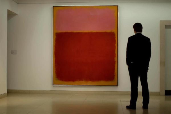 Christie's employee Matt Paton poses for photographs in front of Mark Rothko's "Untitled #17" at the auction house's premises in London, Friday, April 15, 2011. The painting is is estimated to fetch between 11 to 14 million pounds ($18 to 22 million, 12.5 to 16 million euro) when it comes up for auction in New York in May. (AP Photo/Matt Dunham)