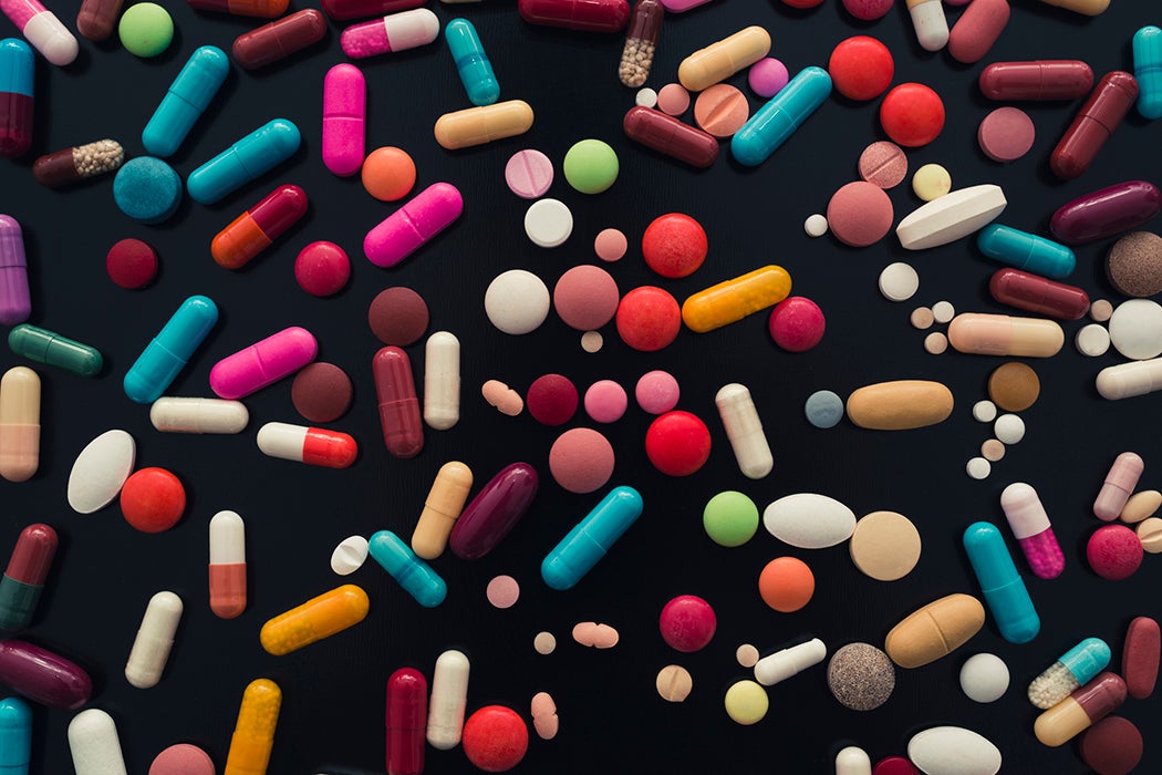 colorful pills on black background