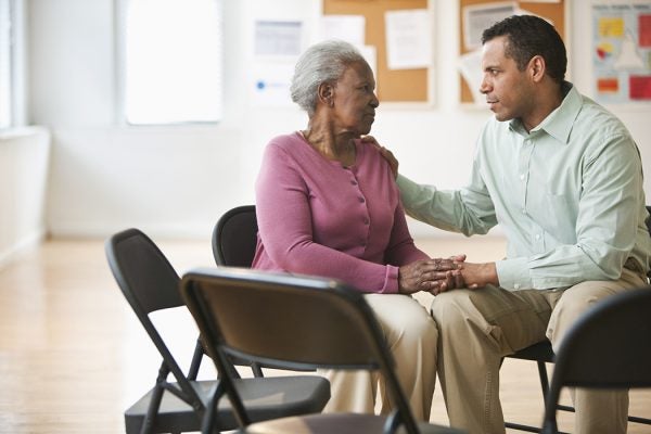 woman speaking with social worker for assistance