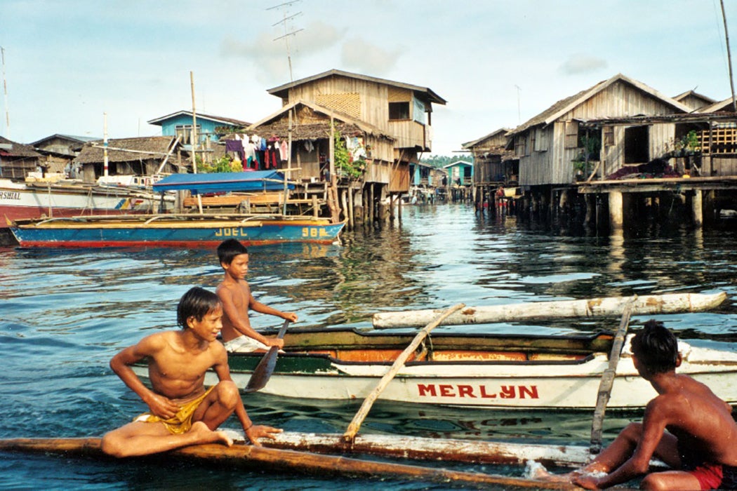 Bajau boys on boat