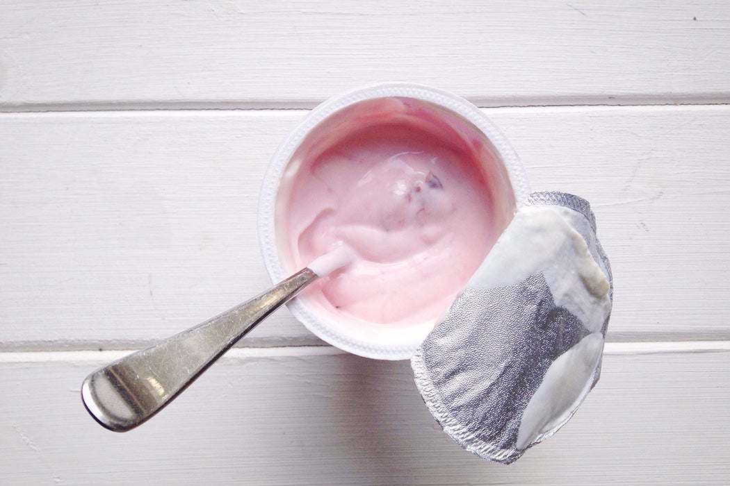 High Angle View Of Yogurt In Disposable Cup On Table