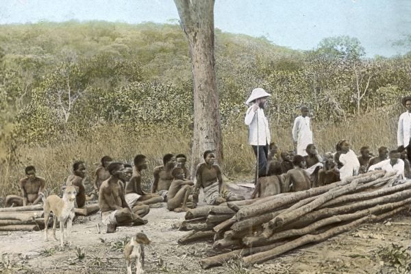 Missionaries speaking to a local group