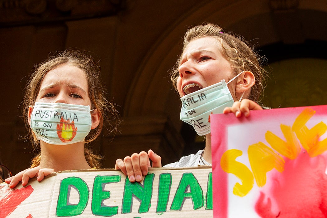 Young girls chant as activists rally for climate action at Sydney Town Hall on January 10, 2020 in Sydney, Australia.