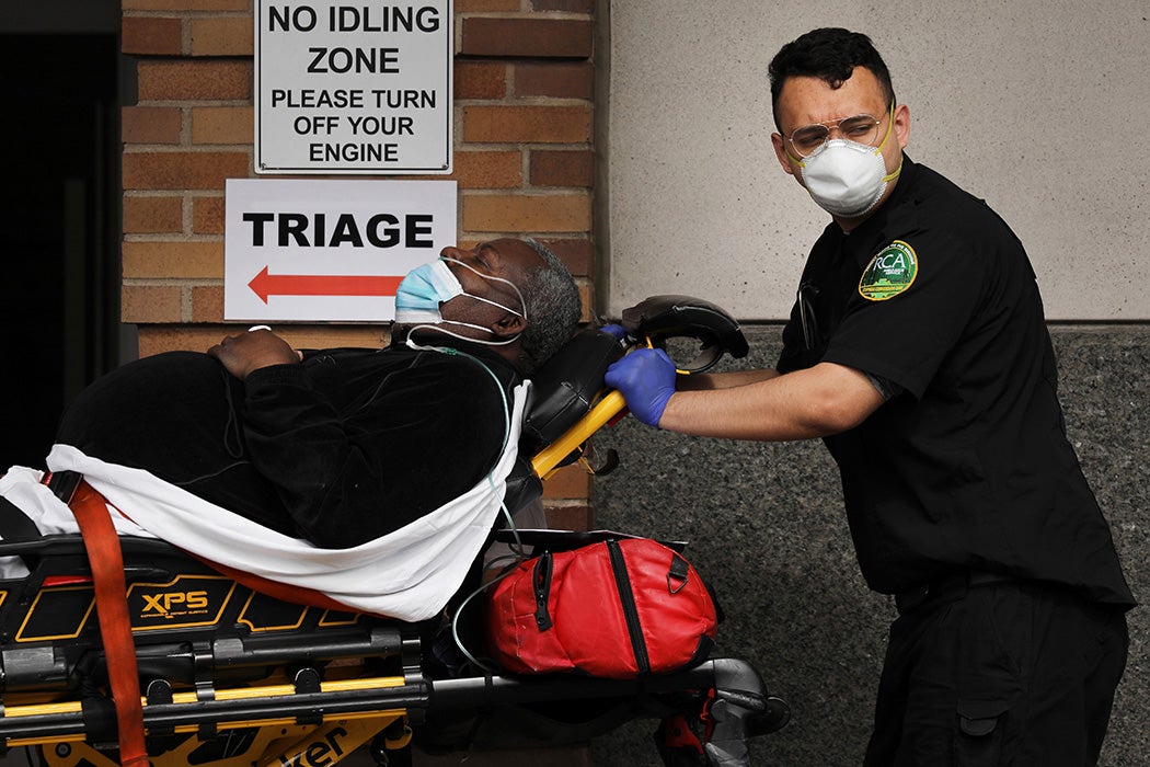 Medical workers take in patients at a special coronavirus intake area at Maimonides Medical Center on April 07, 2020 in the Borough Park neighborhood of the Brooklyn, NY