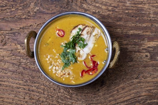 indian Mulligatawny soup in a brass bowl