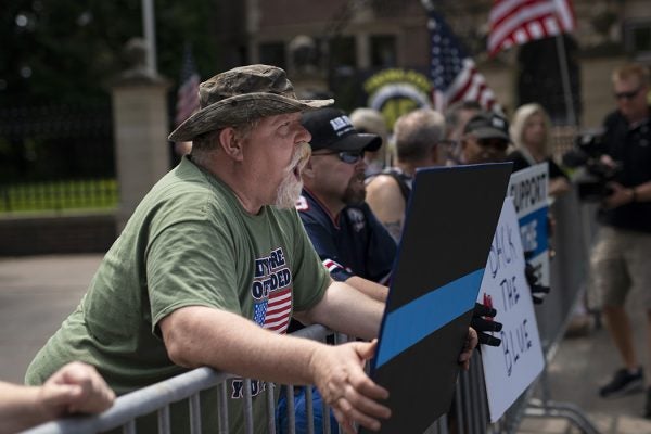 Pro-police demonstrators argue across a temporary barricade during a protest outside the Governors Mansion on June 27, 2020 in St Paul, Minnesota.