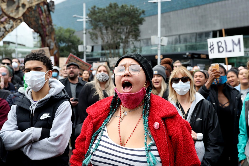 Protesters march down Queen Street on June 01, 2020 in Auckland, New Zealand.