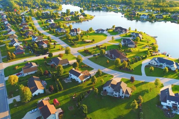 Idyllic neighborhood on lakefront at dawn.