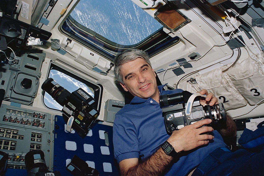 Astronaut Sidney M. Gutierrez, mission commander, pauses on the flight deck during Earth observations on the Space Shuttle Endeavour, 1994