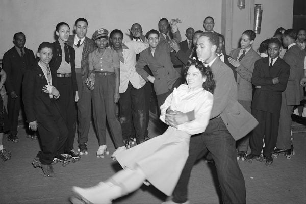 A man swinging a woman on roller skates, Savoy Ballroom, Chicago, Illinois