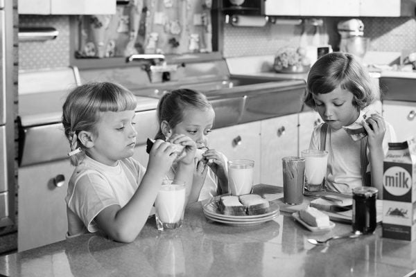 THREE GIRLS SISTERS EATING LUNCH AT KITCHEN TABLE PEANUT BUTTER & JELLY