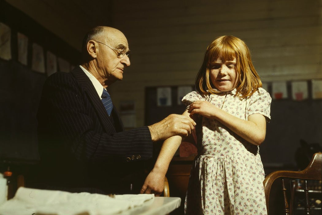 Dr. Schreiber of San Augustine giving a typhoid innoculation at a rural school