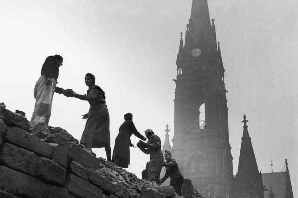 Women form a human chain to carry bricks used in the reconstruction of Dresden, March 1946