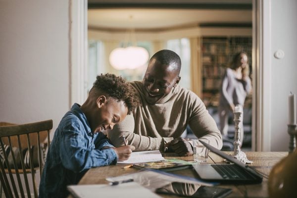 A father teaching his son at home