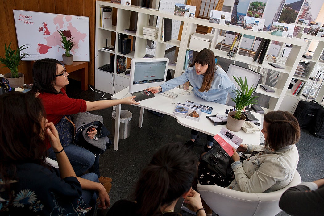 A campaigner gives a leaflet to a woman at the Abortion Travel agency store on April 10, 2014 in Madrid, Spain.