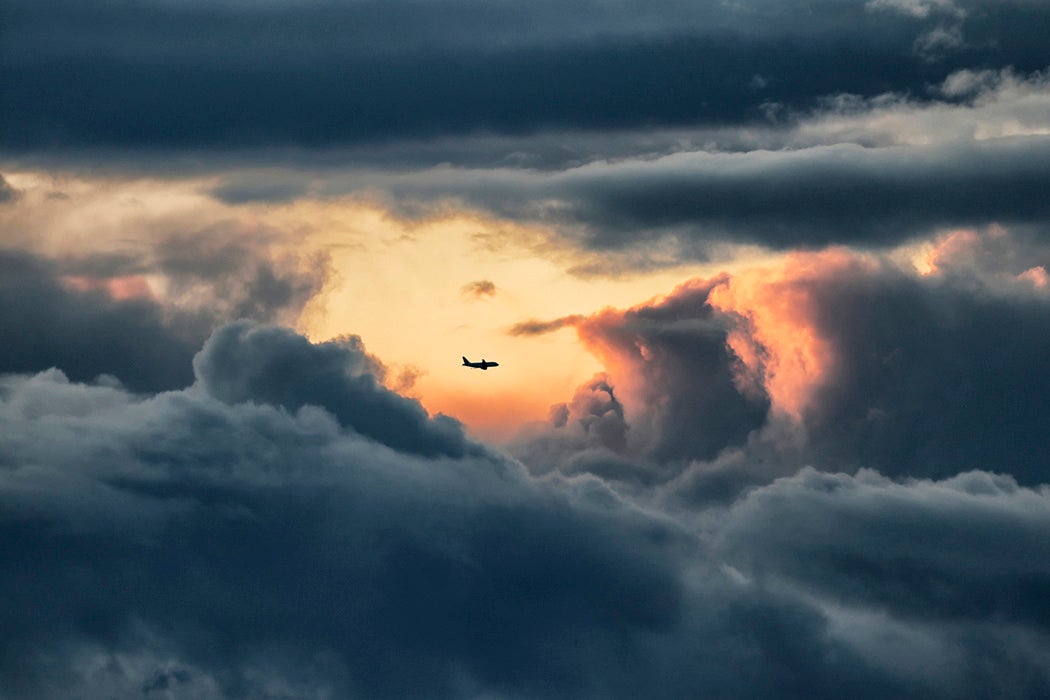 View of an airliner throughout stormy clouds and just inside a calm weather.