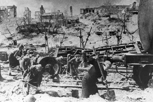 Women digging near damaged train tracks during the Battle of Stalingrad, USSR, during World War II.