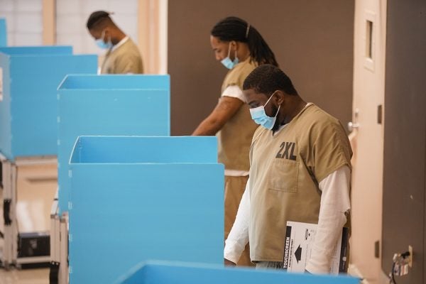 Cook County jail detainees cast their votes after a polling place in the facility was opened for early voting on October 17, 2020 in Chicago, Illinois