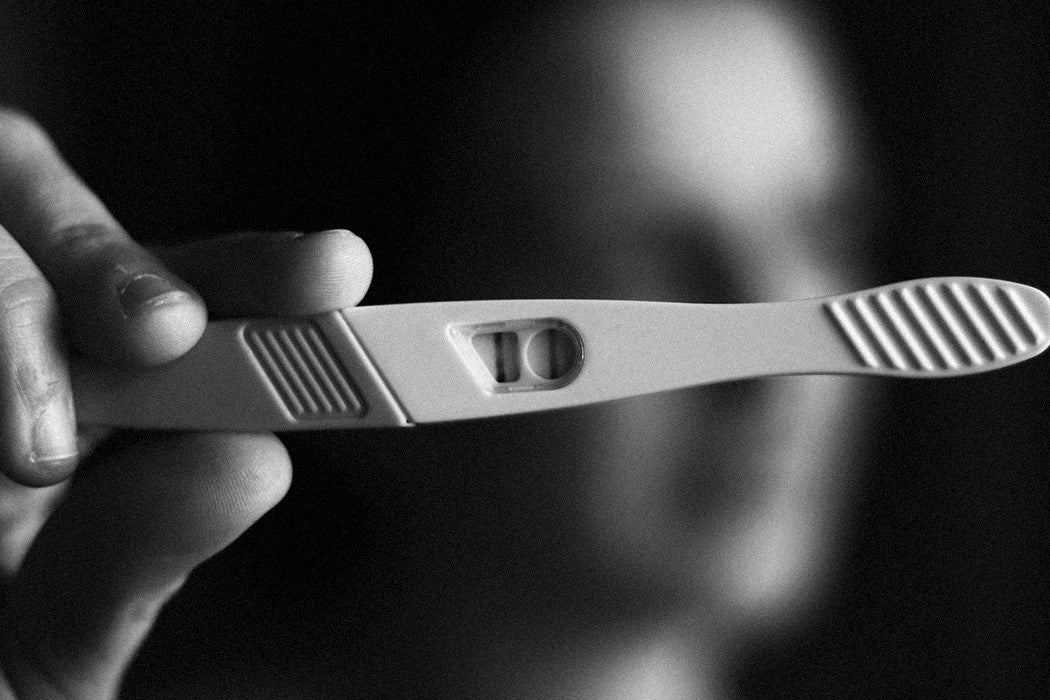 Woman with a home pregnancy test