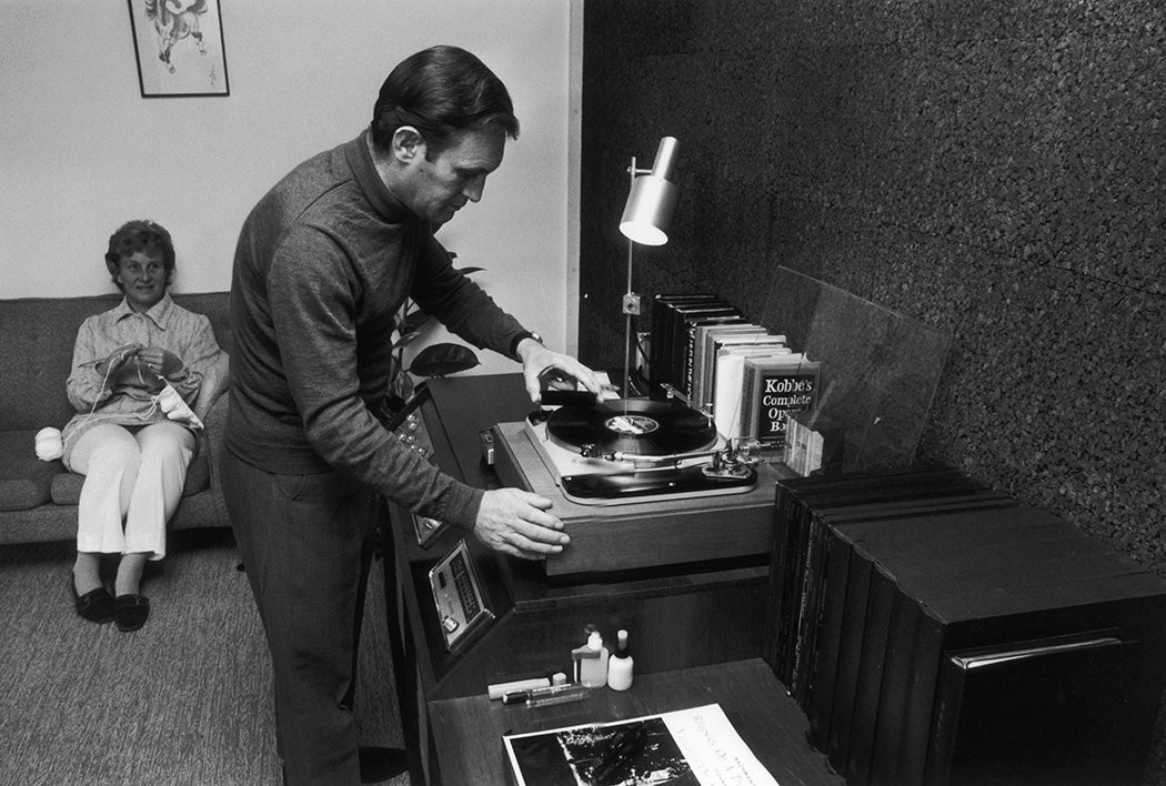 A couple listening to their hi-fi system in a specially converted music room, 1974.