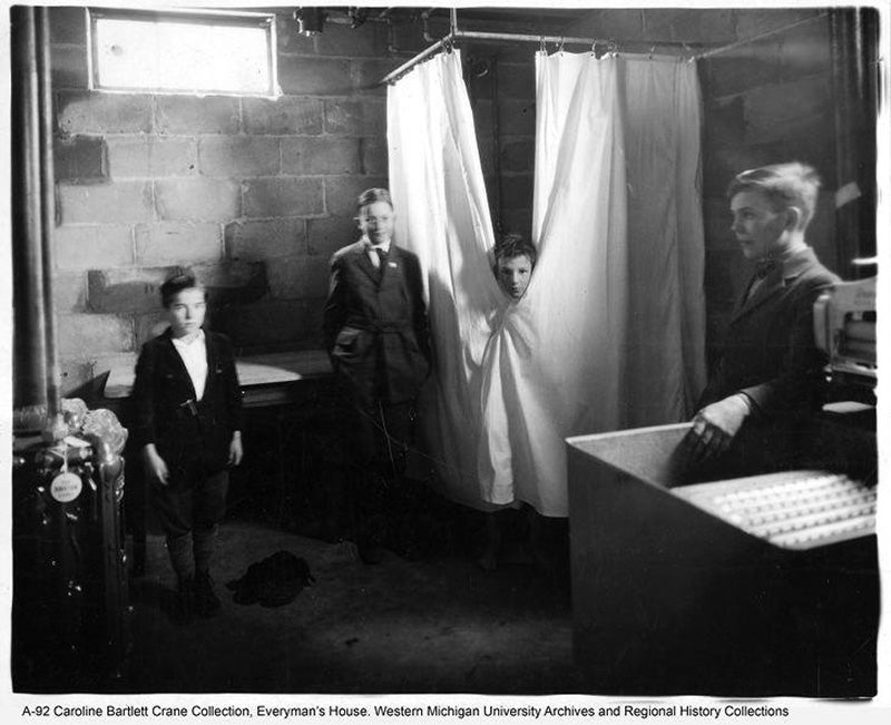 Boys by the shower in the basement of Everyman's House