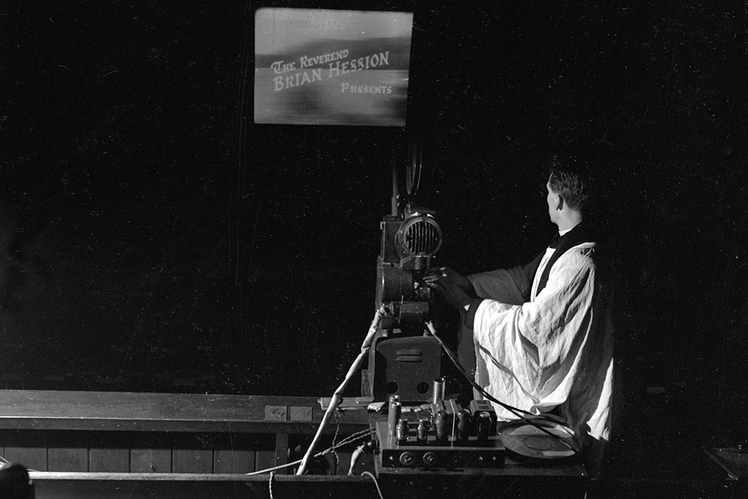 The Reverend Brian Hession of the Dawn Trust and Bible Films Ltd film company starts a showing of a religious film at St Peter's Church, Piccadilly, London, 1946