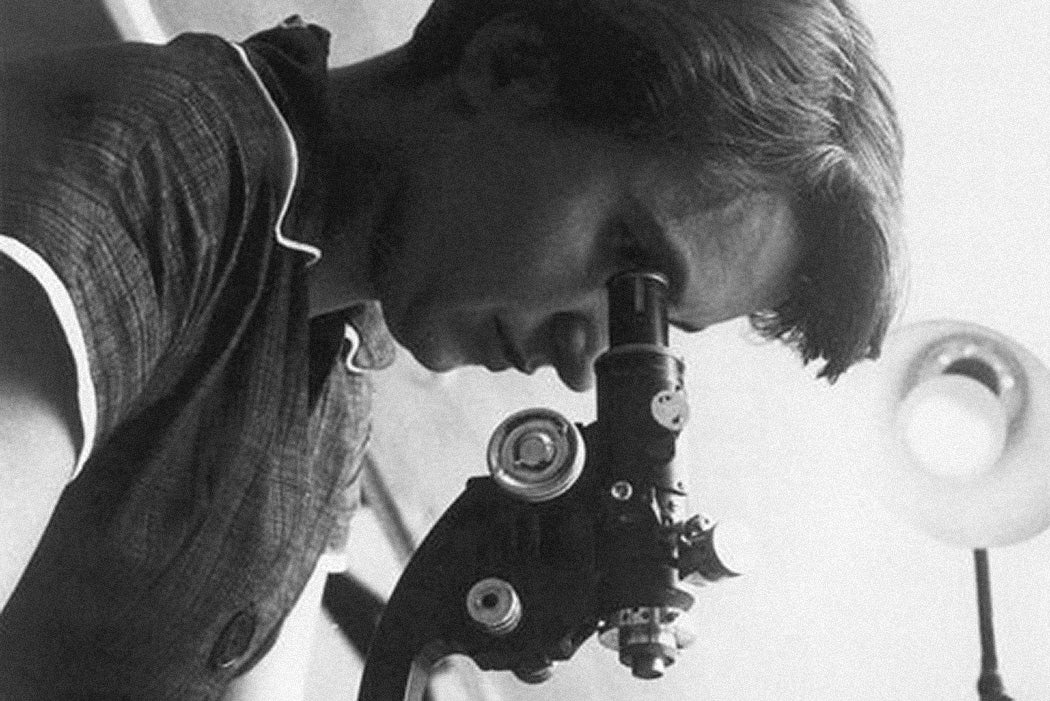 Rosalind Franklin with microscope in 1955