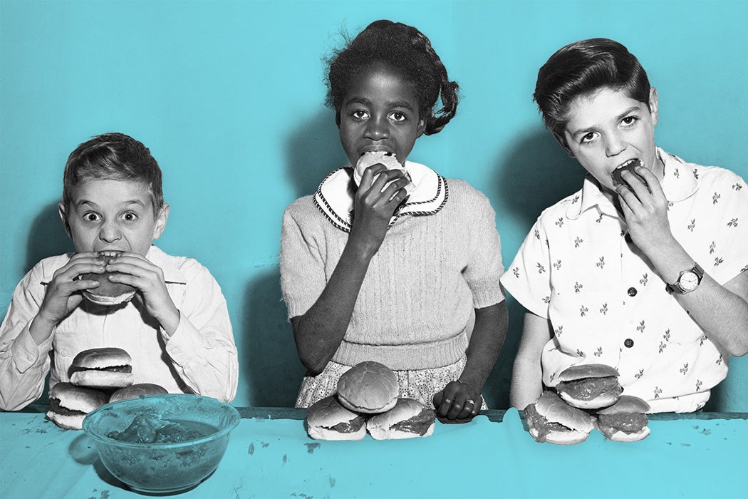 Edwin Gonzalez, Iris Alomar, and Ray Gerdes, the three winners in the inaugural hamburger eating contest, at the Police Athletic League youth center on West 79th Street in New York City, New York, circa 1955.