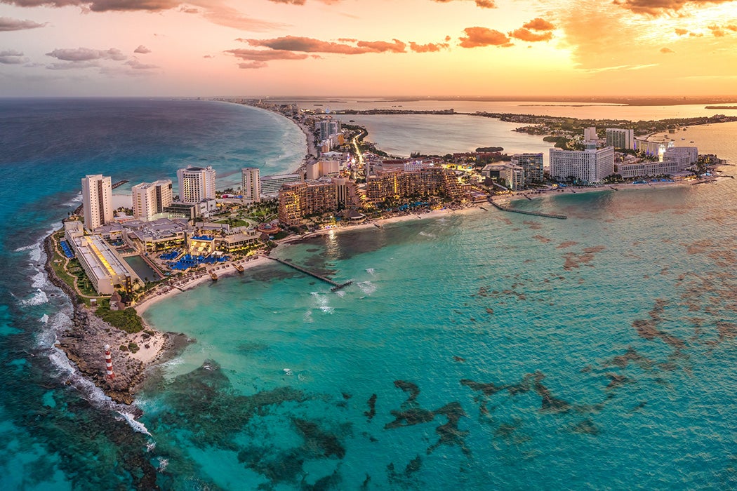 sunset on a Cancun resort with blue water