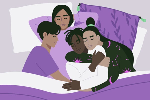 A diverse polyamorous family cuddling in bed, genders and relationships, pansexual lifestyle