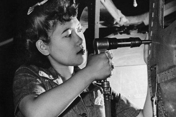 A riveter at work, circa 1940.