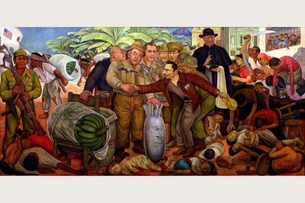 Mural by Diego Rivera which satirizes the role of the US, UFC, Catholic Church and the military in the Guatemalan coup. The individuals giving the handshake are John Foster Dulles and general Castillo Armas.