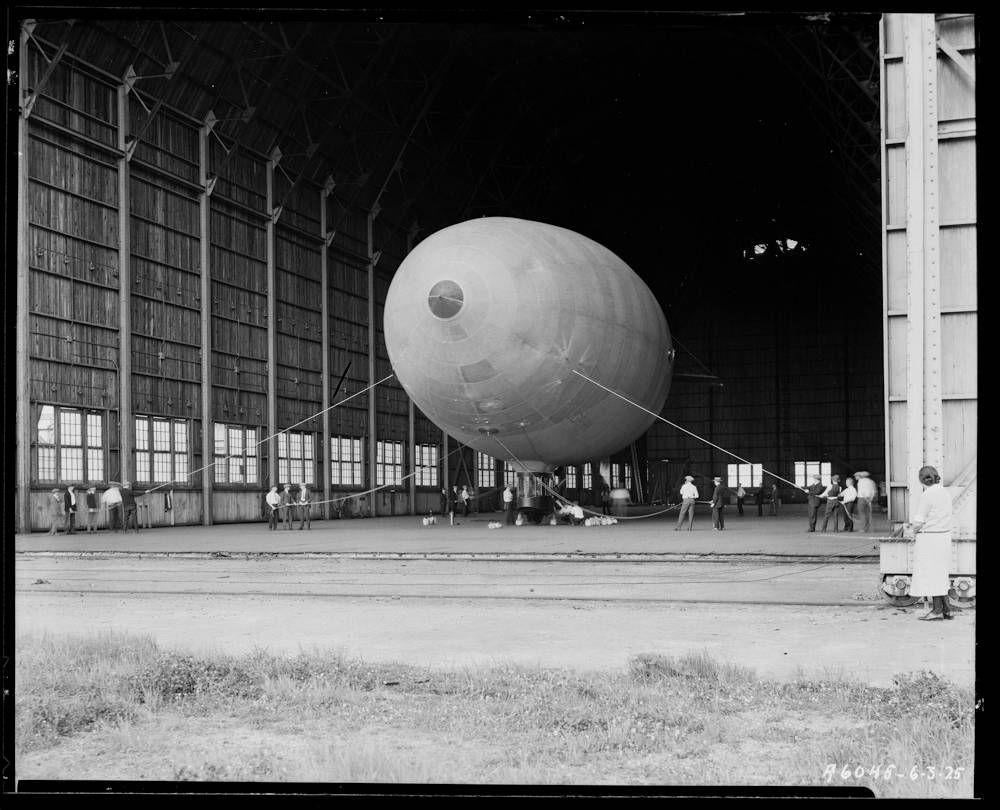 Pilgrim Blimp with AD Sport Coupe Car in a hangar