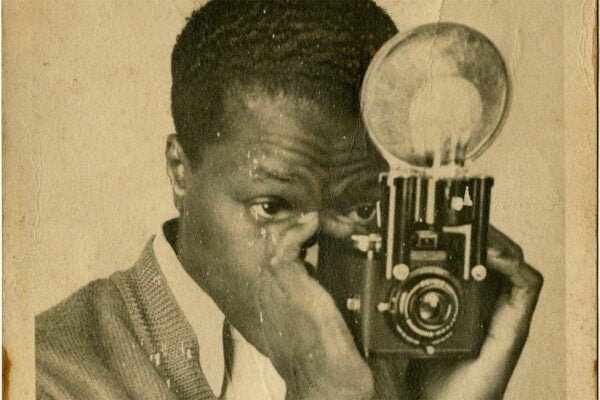 Photograph of Mr. Harrison Williams Holding a Camera