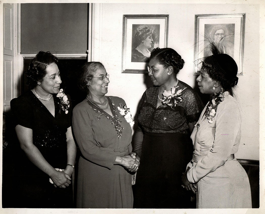 A photograph of Ella P. Stewart (second from left) and three other women during Stewart's time with the National Association of Colored Women.