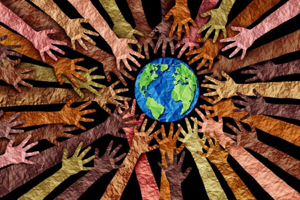 a concept of diverse races and crowd cooperation symbol as hands holding together the planet earth in a 3D illustration style.