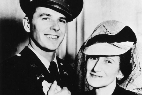 Portrait of Ronald Reagan holding his mother Nelle's hand