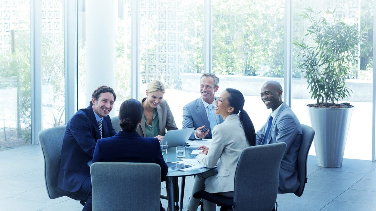 Smiling people in a conference room