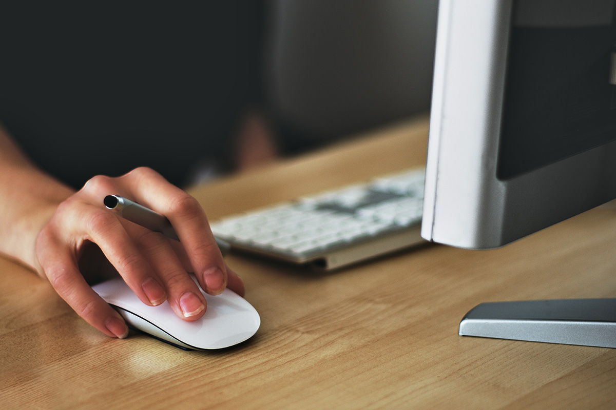 Hand on apple magic mouse