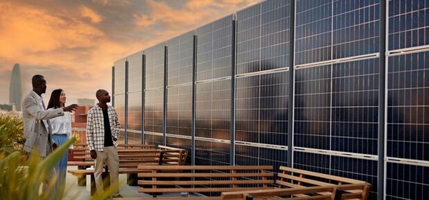 Broker and Prospective Buyers Admiring Solar Energy System